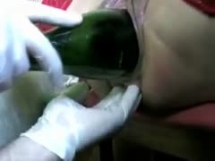 With a bottle, pussy